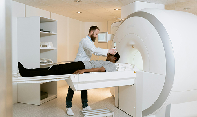 Doctor reviewing brain MRI results to assess severity of chronic small vessel ischemic disease