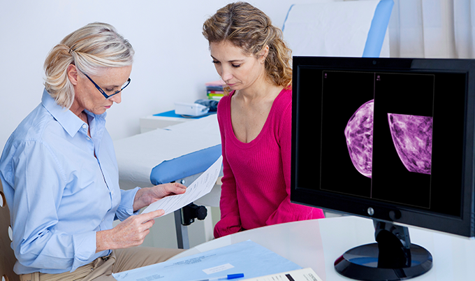 Woman receiving emotional support during medical consultation about mammogram results