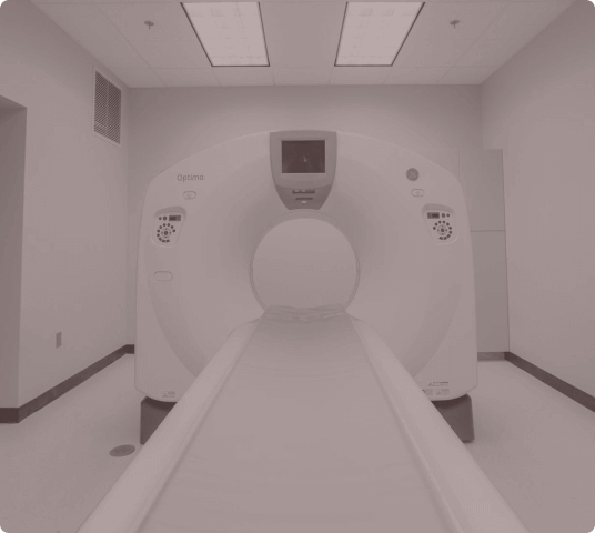 CT scanner machine in a clinical room ready for patient imaging.
